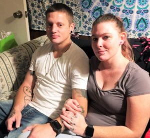Benjamin, with his fiancée, shows off a rosary tattoo he got in honor of his late grandmother, who “pretty much” raised him. (Photo: Kathie Ragsdale)